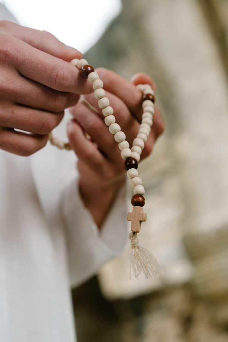 a person holding a rosary